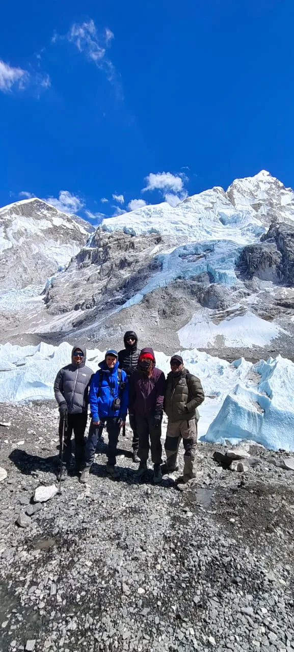 Trekking group at Everest Base Camp with glacier