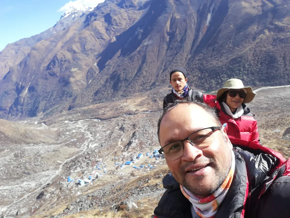 Prem with trekkers at a mountain base camp in Langtang