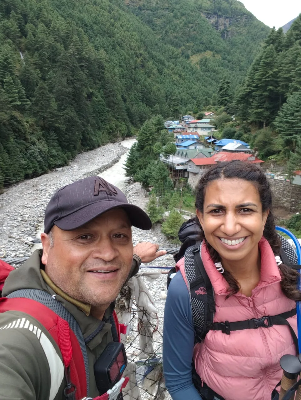 Prem with a trekker above a mountain village on the Everest trail
