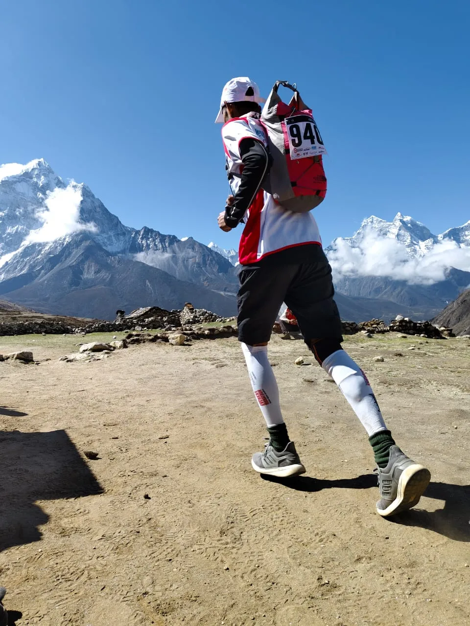 Trail runner near Everest with Ama Dablam behind