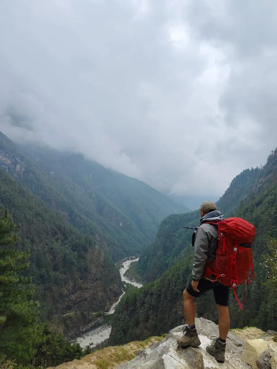 Trekker overlooking a deep valley in the Khumbu region